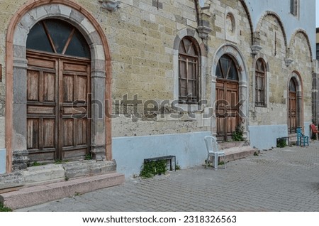 wooden doors and facade of Ayios Haralambos Church in Cesme (Izmir province, Turkiye) Royalty-Free Stock Photo #2318326563