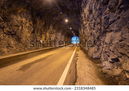 The view through a tunnel in the mountains of Taiwan is captivating, as the tunnel passages are traditionally carved. It offers a glimpse into the rich heritage and craftsmanship of the region Royalty-Free Stock Photo #2318348485