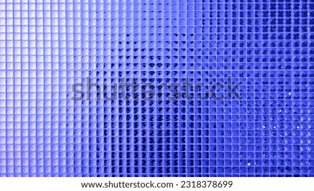 Blue color Mosaic pattern of tiles.Wall is decorated with stained glass small plate, Beautiful mosaic wall luxurious or ceramic wall for luxurious pattern background