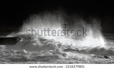 The real thing: stormy, dark , windy, with a moment of light. West portuguese coast during a sea storm in early March 2013