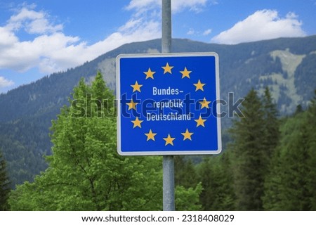 Close-up of a sign Bundesrepublik Deutschland at the border of Germany and Austria in Bayrischzell