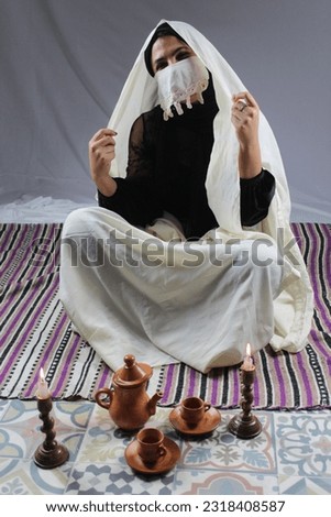 beautiful Algerian Woman wearing hayak  Royalty-Free Stock Photo #2318408587