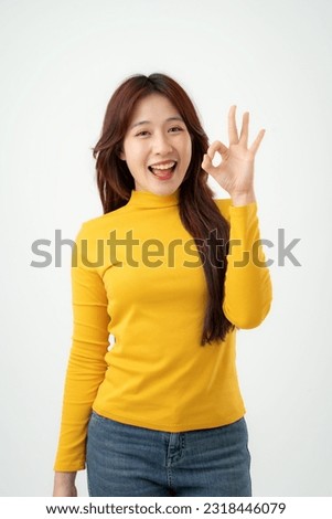 Beautiful asian woman with happy expression in white background. Studio shot. Isolated on white background.