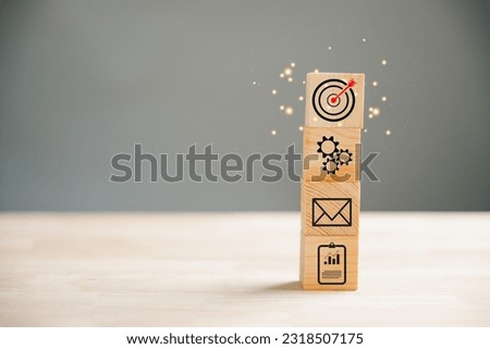 Action Plan, Goal, and Target icons on a wooden block cude step. Success and business target concept. Project management and company strategy symbolize achievement.