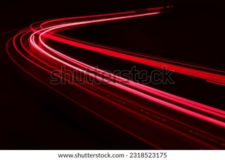 lights of cars driving at night. long exposure Royalty-Free Stock Photo #2318523175