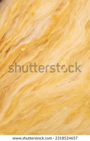yellow mineral wool with a visible texture Royalty-Free Stock Photo #2318524657