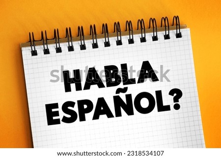 Habla Espanol? text on notepad, concept background
