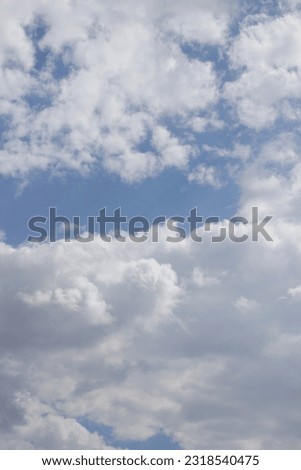 white clouds, blue sky, sky on a sunny day, June, noon at twelve o'clock, the sun behind the clouds, good mood, summer is in full swing, summer, background, white and blue, light and shadow