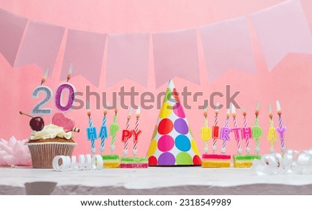 Background date of birth number  20. Anniversary. Beautiful festive background with candles for a girl. Women's congratulations postcard. Happy birthday in pink.