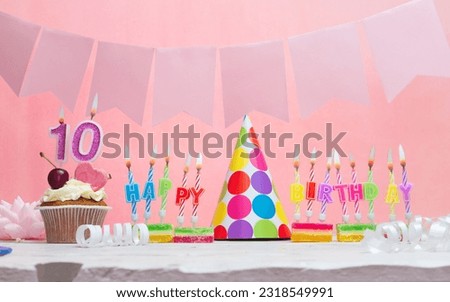 Background date of birth number  10. Anniversary. Beautiful festive background with candles for a girl. Women's congratulations postcard. Happy birthday in pink.