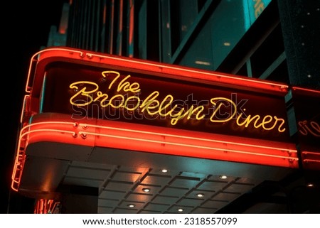 Brooklyn Diner neon sign at night in Times Square, Manhattan, New York