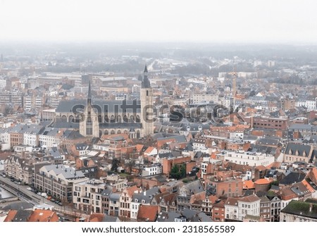 View over the beautiful midieval city of Mechelen a seen from the top of the Sint-Romboutskathedraal. The Church in the centre of the picture is the mechelen Onze-Lieve-Vrouw-over-de-Dijlekerk.