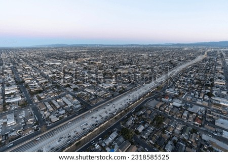 Dawn aerial view of the Harbor 110 freeway near Florence Ave south of downtown Los Angeles in Southern California.   Royalty-Free Stock Photo #2318585525