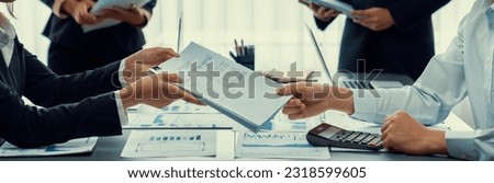 Auditor team collaborate in office, analyzing financial data and accounting record. Expertise in finance and taxation with accurate report and planning for company revenue, expense and budget. Insight Royalty-Free Stock Photo #2318599605