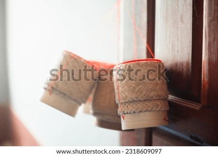 Sticky rice basket made of bamboo on blur background. Image about handmade by asia people.