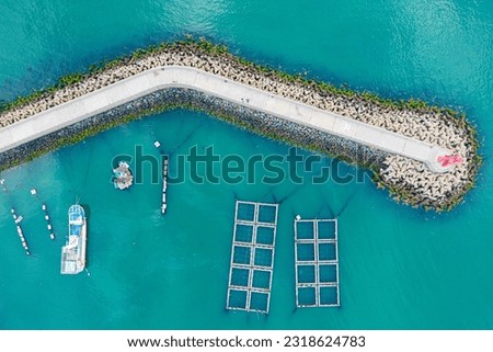 Breakwater and Lighthouse Guarding Small Ports in the West Sea of Korea Royalty-Free Stock Photo #2318624783