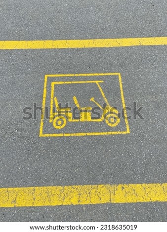 Yellow golf car sign in road marking