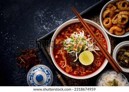 Thai food, Nam Ngiao dessert.
Nam Ngiao Noodles, Noodles in thick sauce. Lanna local food. Royalty-Free Stock Photo #2318674959