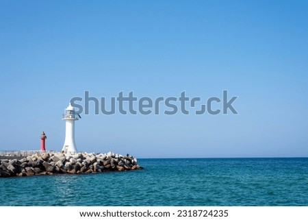 East sea breakwater landscape, with blue sky. Royalty-Free Stock Photo #2318724235