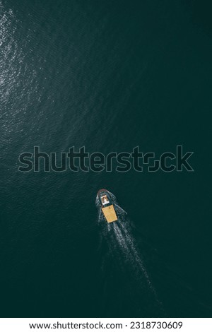 Aerial view to a fishing boat in the sea