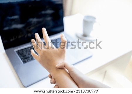 Asian female employee with tendon problems,Trigger Finger disease,Carpal Tunnel Syndrome,De Quervain's Tenosynovitis,sensations of tingling,numbness of muscle in hands and wrist,beriberi in fingertips