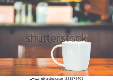 Coffee cup in coffee shop - vintage effect style picture