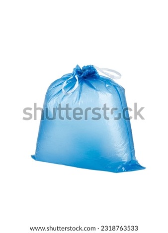 Closed full, stuffed, inflated blue garbage bag with ties,isolated on a white background. Photo Royalty-Free Stock Photo #2318763533