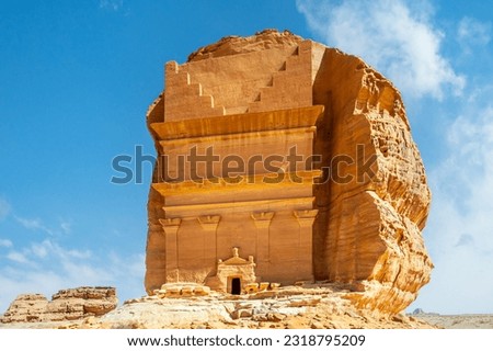 Entrance to the ancient nabataean Tomb of Lihyan, son of Kuza carved in rock in the desert,  Mada'in Salih, Hegra, Saudi Arabia Royalty-Free Stock Photo #2318795209