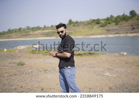 Young Man Posing outdoor riverside
