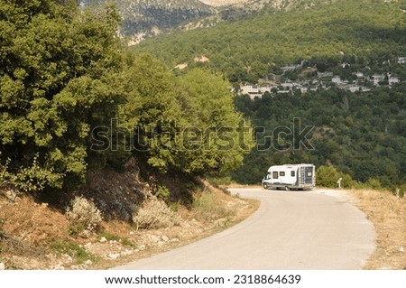 Camper van on a mountain road in Northwestern Greece