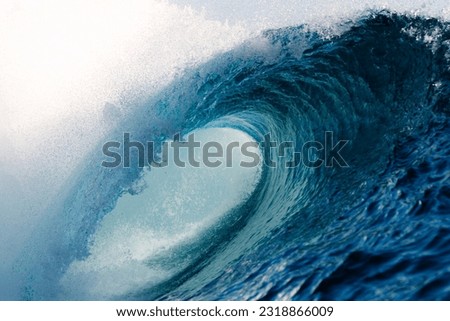 Teahupo'o wave breaking hard over the coral reef Royalty-Free Stock Photo #2318866009