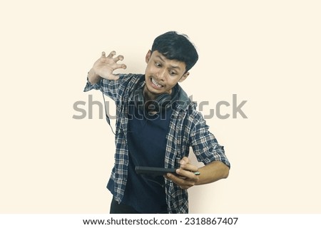 young asian man showing angry expression