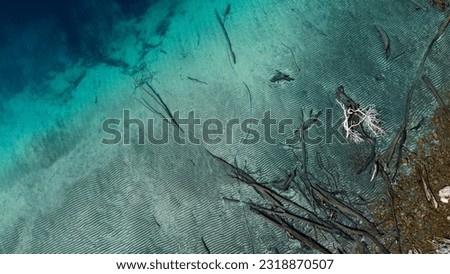 Aerial photo of a lake with clear water