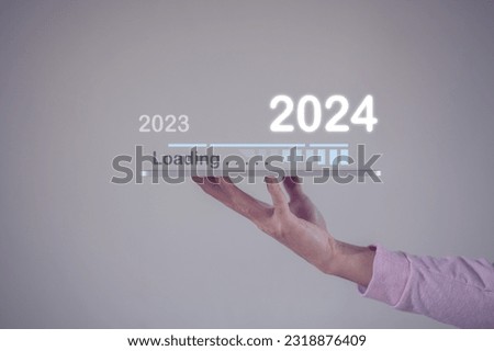 New year 2024 is loading, calendar date, end of the year, Countdown to 2024 concept. The virtual download bar with loading progress bar for New Year's Eve and changing the year 2023 to 2024
 Royalty-Free Stock Photo #2318876409