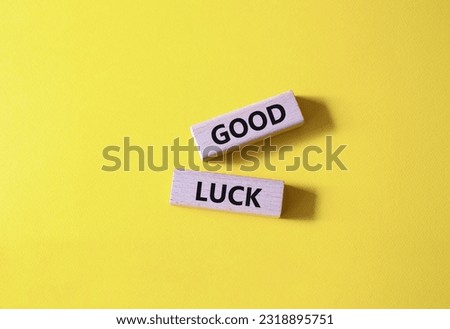 Good luck symbol. Wooden blocks with words Good luck. Beautiful yellow background. Business and Good luck concept. Copy space. Royalty-Free Stock Photo #2318895751