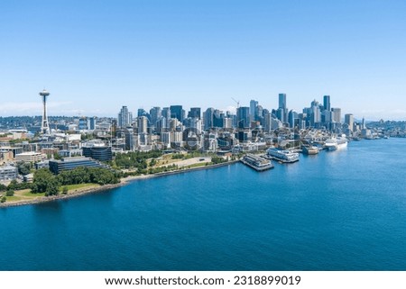 The Seattle, Washington waterfront skyline on a sunny day in June Royalty-Free Stock Photo #2318899019