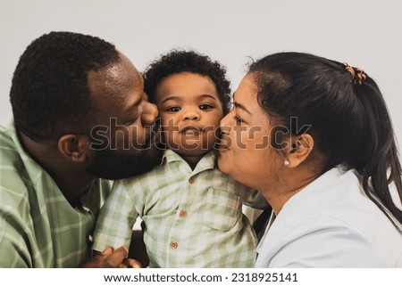 Happy family relationship moments, portrait african american handsome father and beautiful Asian mother in healthy good mood taking pictures together with innocent cute half Thai-Nigerian son baby.