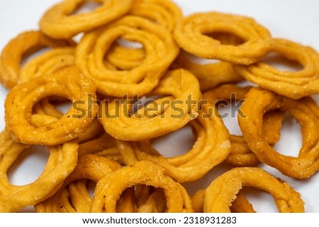 This image is about crunchy Butter Murukku in white background Stock Photo