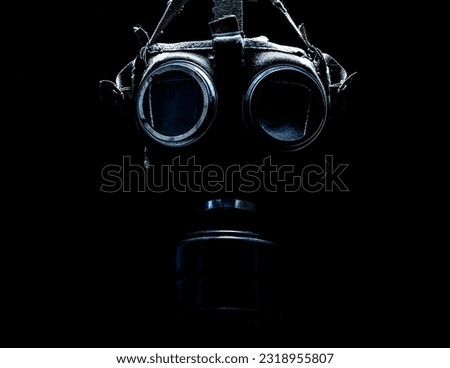 gas mask in the dark Royalty-Free Stock Photo #2318955807