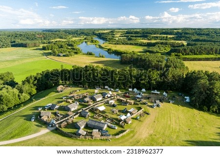 Aerial view of Kernave Archaeological site, a medieval capital of the Grand Duchy of Lithuania, tourist attraction and UNESCO World Heritage Site. Sunny summer evening.