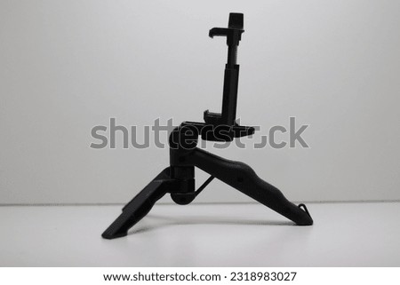 Mini tripod for cell phones and cameras, photo and video shooting equipment