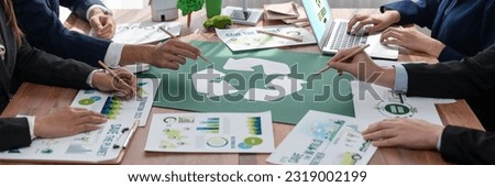 Group of business people planning and discussing on recycle reduce reuse policy symbol in office meeting room. Green business company with eco-friendly waste management regulation concept.Trailblazing Royalty-Free Stock Photo #2319002199