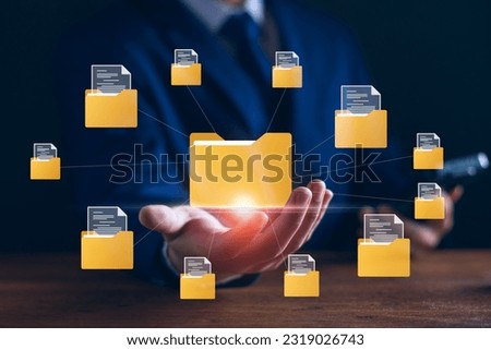 Document management digital document paperless operation concept, Businessman holding e-document in hand and use technology to organize documents online management Storage on cloud computing