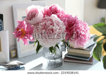 Bouquet of pink peonies at home on the table