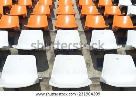 White and Orange chair at the stadium.