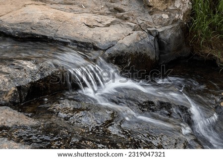 Beautiful small waterfall in forest	
