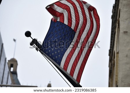 American flag waving on windy day 