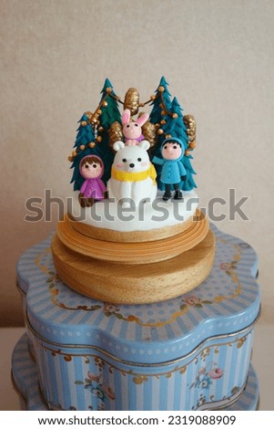 Clay couples with white bear and pink rabbit in christmas scenery