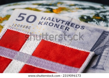 Denmark Money, 50 danish kroner banknote together with national flag, Financial and business concept, close up