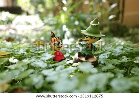 Miniature dolls in the afternoon garden